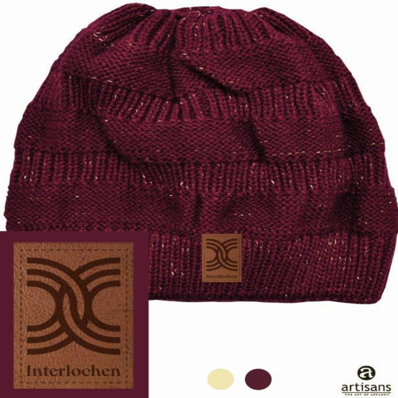 A red beanie with a sparkly Interlochen logo patch on it, displayed against a white background.