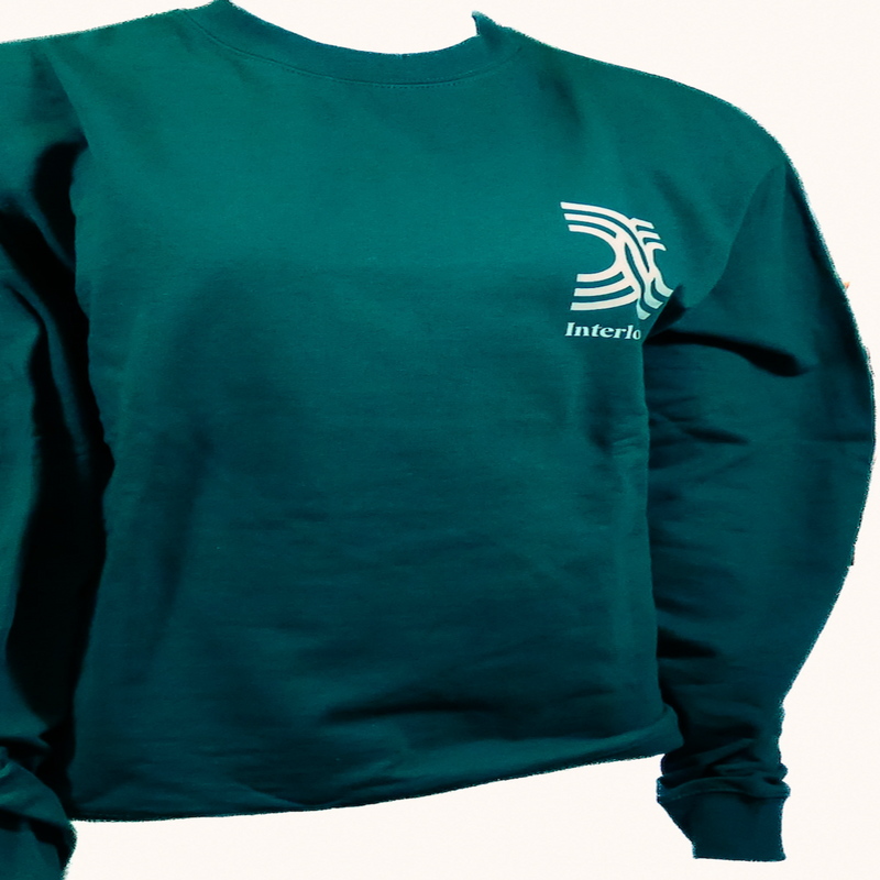 A green crew neck sweatshirt with white text that reads  'Film and New Media' and a symbol on the left chest area.