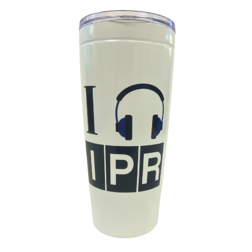 White tumbler with black text and headphones graphic on a white background