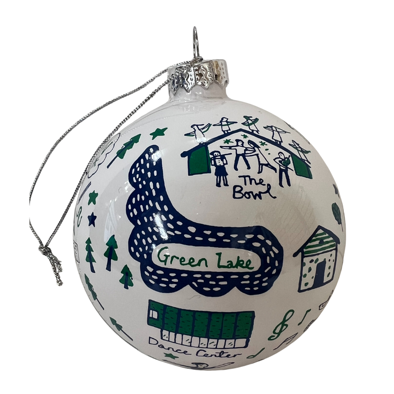 Decorative Christmas ball ornament with illustrations and text on a white background