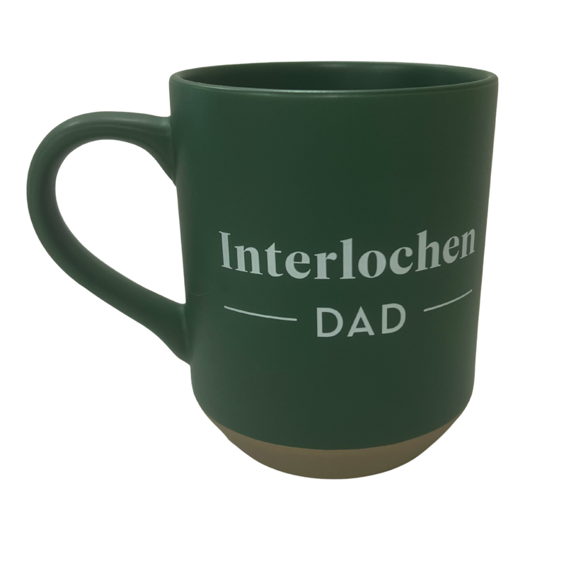 Green mug with 'Interlochen DAD' text on a white background