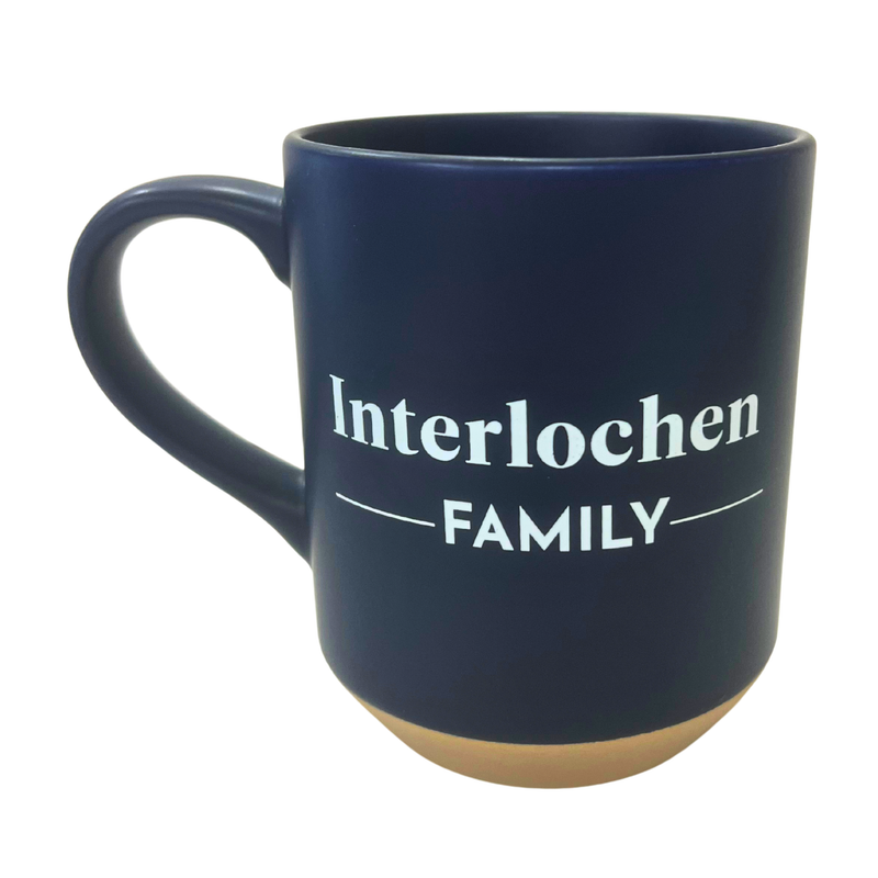 Navy blue mug with 'Interlochen Family' text on a white background