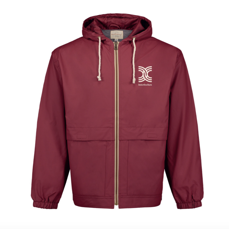 Burnt Red rain jacket with a cream colored logo on upper left chest